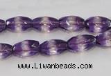 CSA25 15.5 inches 7*12mm faceted rice synthetic amethyst beads